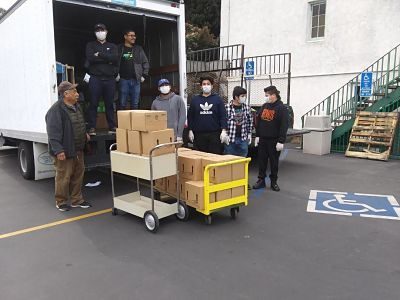 Volunteers get ready to set up the food distribution stations.