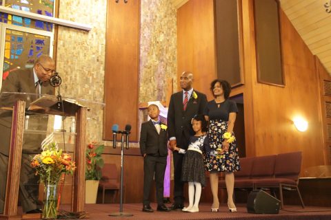 At Peter Baptiste’s ordination, Lee encourages him to “preach the word” in his ministerial charge.