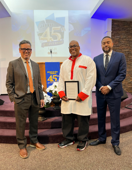 SCC Executive Secretary Danny Chan, Childs, and SCC GLAR Director Lawrence Dorsey II display a letter presented by SCC commemorating the occasion.