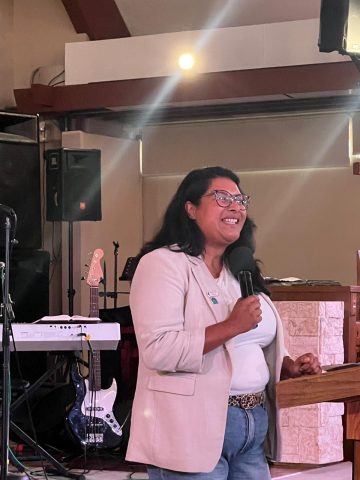 Alfaro shares a message at the ElevateHER worship event.