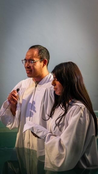 A student literature evangelist is baptized at the iShare Convention, a weekend-long event where student literature evangelists from the Pacific Union Conference gather to share testimonies and worship.