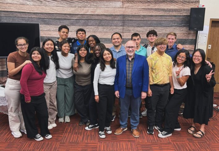 John H. Cress, SCC president, encourages the youth rush team with a devotional message.