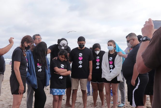 Salazar offers a prayer of dedication over the girls before their baptism.