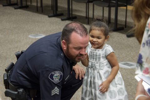 Glendale City church members of all ages fellowshipped with officers after bringing lunch and a signed “thank you” poster to the police department. Photo by Mark Azali