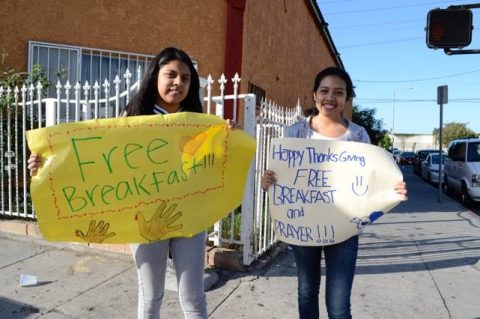 Young adults spread the word about the event with handmade posters. Photo courtesy of Gladys Pacheco