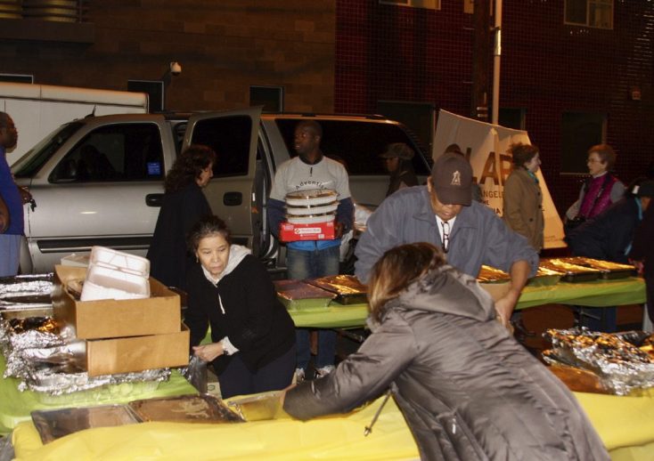 White Memorial Church volunteers unload donated food and other items for the meal. Photo by Giovanni Quiroz