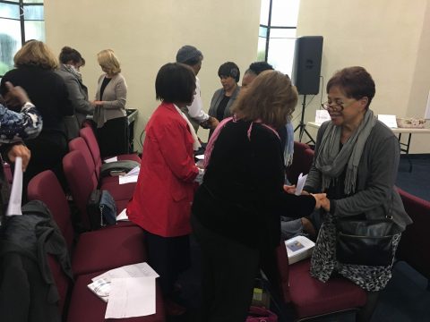 Following the “name game,” women pair up to open their hearts to one another and share a moment in prayer. Photo by Lauren Armstrong