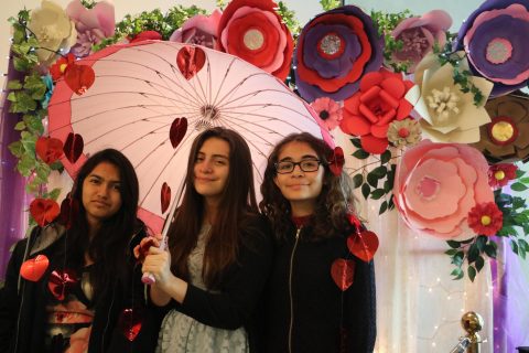 Young women took a moment to pose together at the decorated photo booth. Photo by Karina Camacho