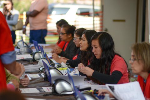 Volunteers did onsite registration for patients. Another team, directed by Kathleen Meyer, did onsite volunteer registration. Photo by Samuel Chung