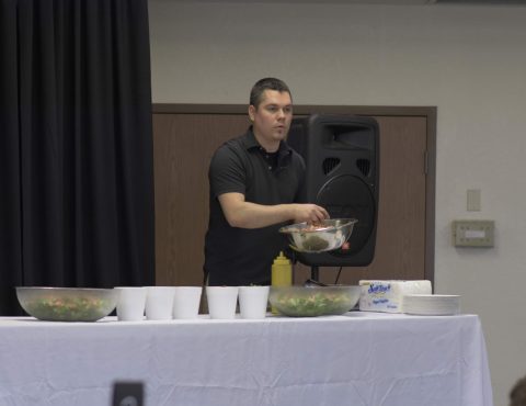 Jeremy Williams demonstrates food preparation used in his Vegan Korner, Colton, Calif., a vegan pizza restaurant. Photo by Sam Ream