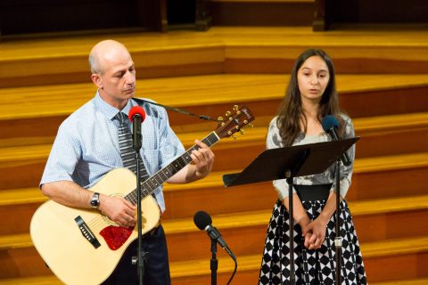 Pastor Khachatryan and his daughter Noemi perform for the pastoral introduction service. Photo by Mark Azali