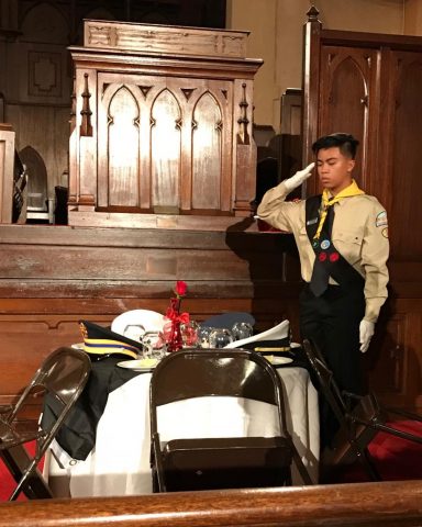 Pathfinder Noah Recalde salutes during “The Missing Man’s Table and Honor Ceremony,” honoring men and women who gave their lives for their country. Photo by Betty Cooney