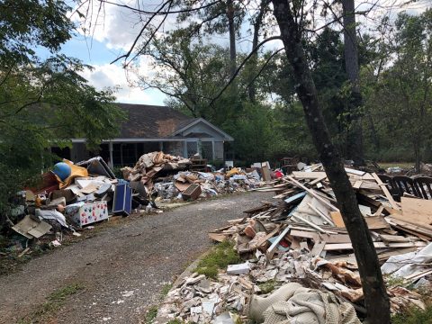 During the trip, students cleaned up this home that was hit by Hurricane Harvey (pictured before). Photos by Pono Lopez