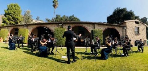 Ausente conducts the SGA Orchestra during a fall performance.