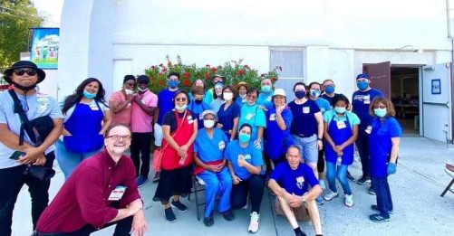 Volunteers gather for a photo before opening the doors to welcome shoppers for the most recent event on August 15, 2021.