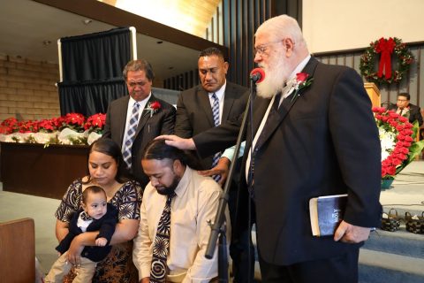 Tonga (front right) is ordained as a deacon.