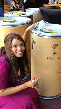 Reynolds decorates a barrel.