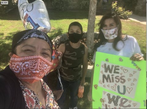 Calderon (left) participates in a socially distanced birthday for one of her students.