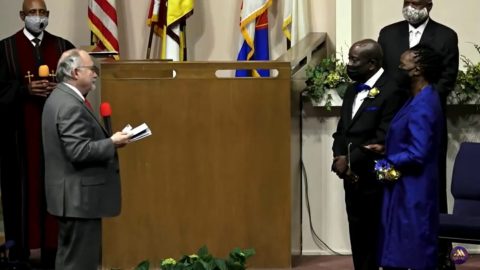 Cress (front left) presents Barksdale with his credential.