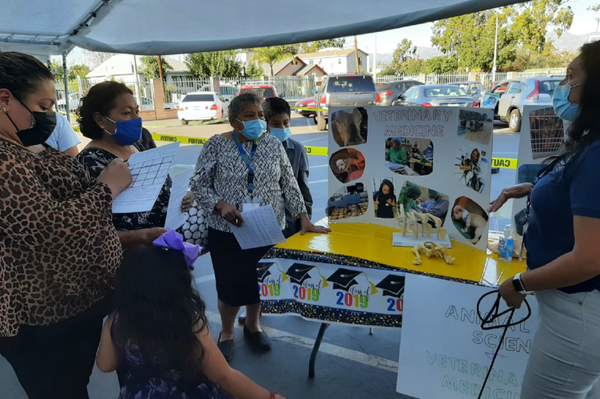 Attendees line up to meet with a veterinarian at Career Day in November.