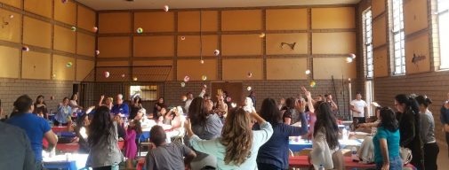 In an activity designed to teach children how to pray, participants first wrote prayers on a beach ball, then tossed the ball in the air. Whoever picked it up would pray over the written requests and praises.