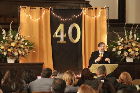 Pastor Giddell Garcia preaches a message to encourage members to be faithful and stay in the presence of God following this anniversary celebration