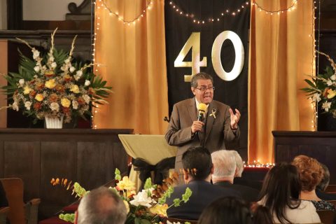 Salazar engages with church members during the Sabbath School program.