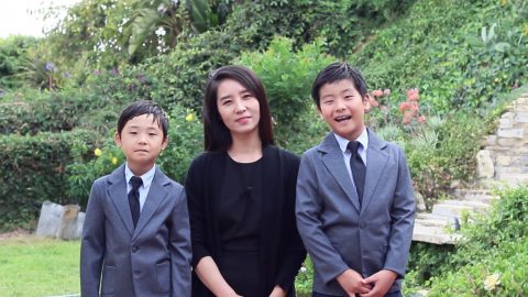 Enoch Lee’s wife and their two sons record a special message for the ordination.