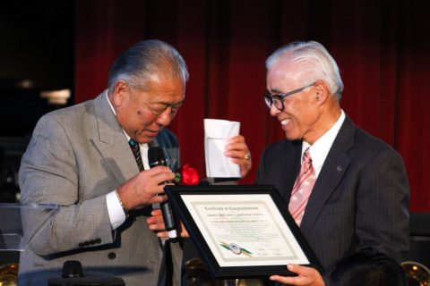 Rodney Tanaka, representative from the Gardena mayor’s office, presents a certificate of congratulations to Headmaster Chris Ishii for the school’s milestone anniversary. Photos by Dennis Imai.