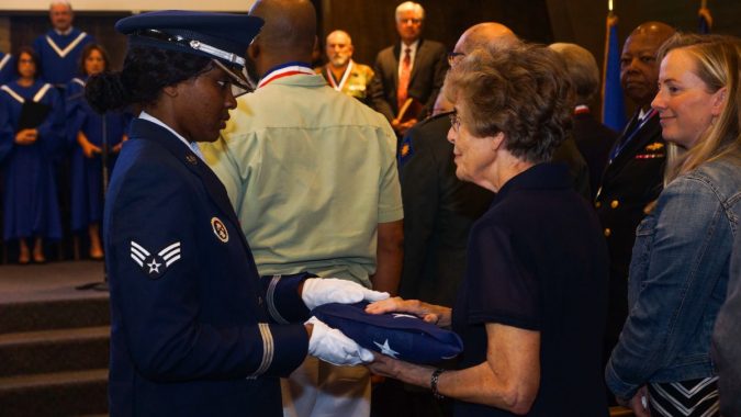 After a moving flag-folding ceremony, the U.S. flag is presented to Marilyn Crane, widow of honoree Michael Crane, MD, captain, U.S. Army. Photos by Danny Syto.