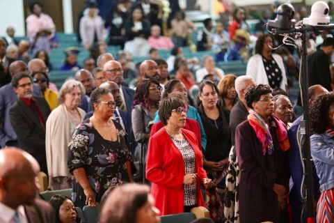 The congregation streams forward in a show of expectant faith in response to the divine worship appeal, singing “Turning Around for Me.”