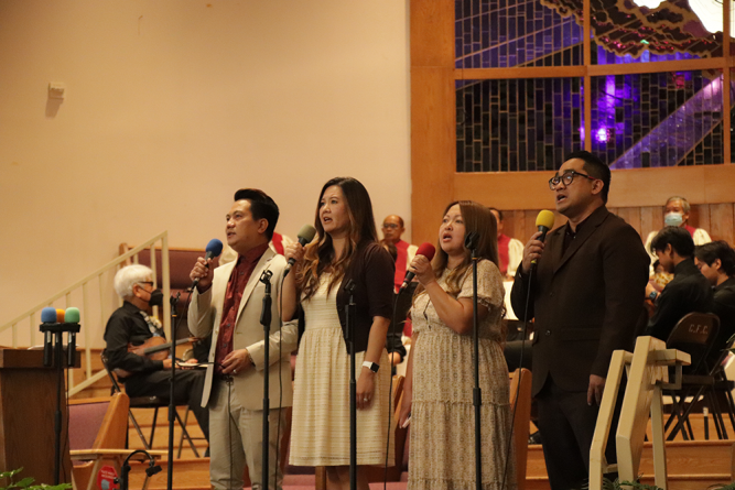 The praise team leads the congregation in singing “Wings of an Eagle,” the 65th anniversary theme song, which was performed various times throughout the day.