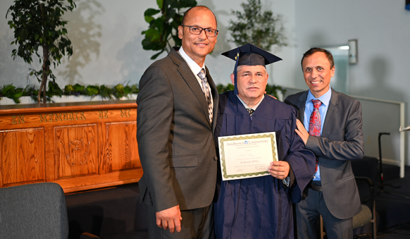 Gonzalez (left) and Heras (right) are pictured with Jhon Ruge (center), member of El Sereno Spanish church.