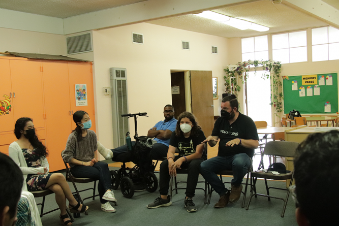 Attendees gather in a circle for the breakout session entitled “Awkward Conversations,” where Adam Hicks (center), associate pastor at Temple City, leads a discussion geared toward tough questions.