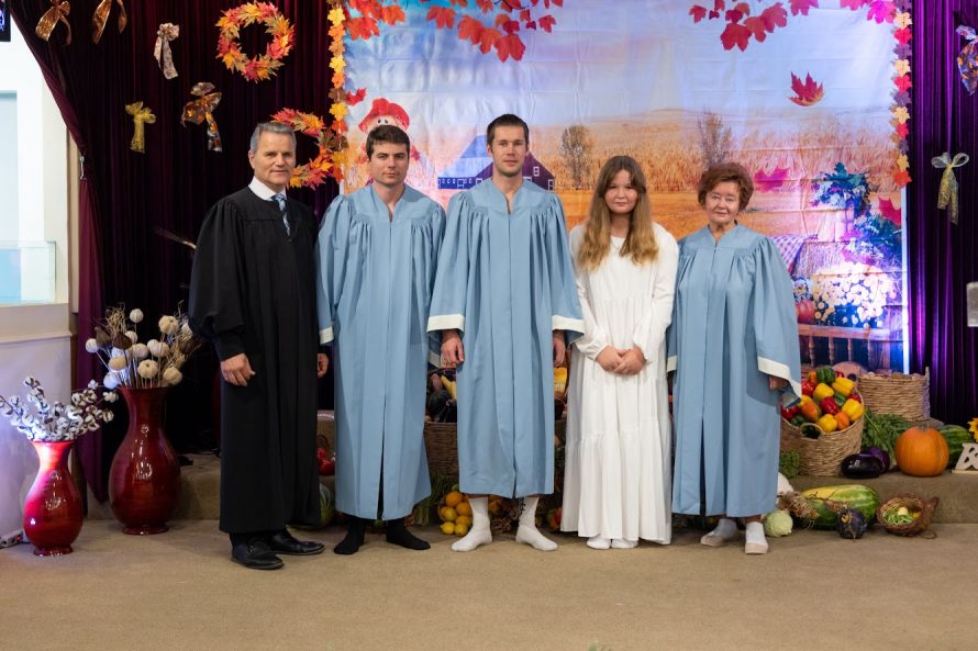 (From left to right) Gurduiala, Oleg, Ruslan, Violina, and Ludmila pose for a photo before the baptisms.