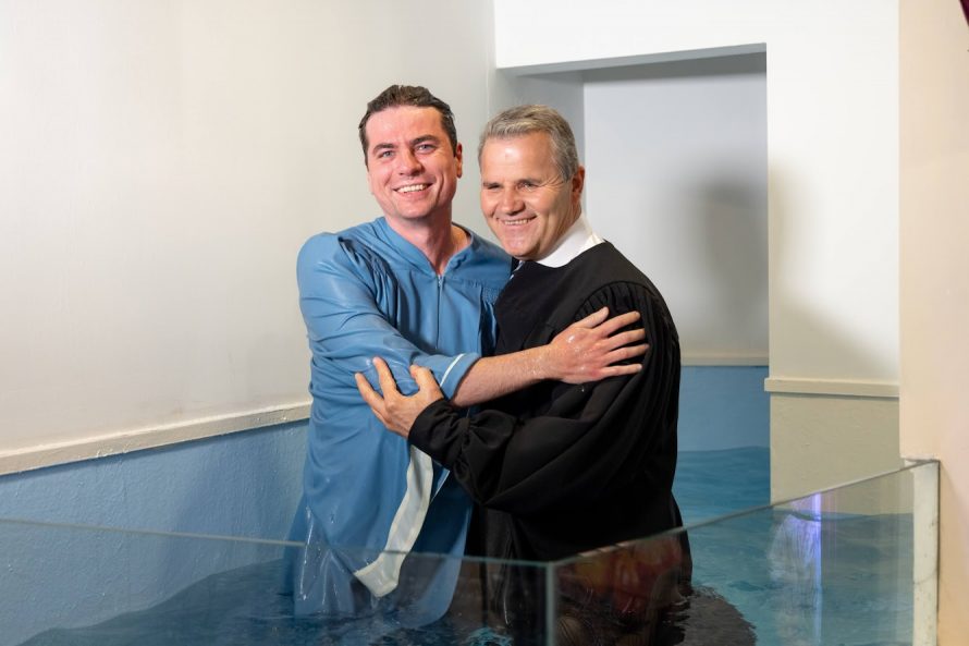 Oleg and Gurduiala embrace following Oleg’s baptism.