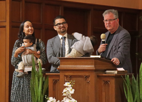 Marco and his family are introduced to the congregation by West Region Director Greg Hoenes.