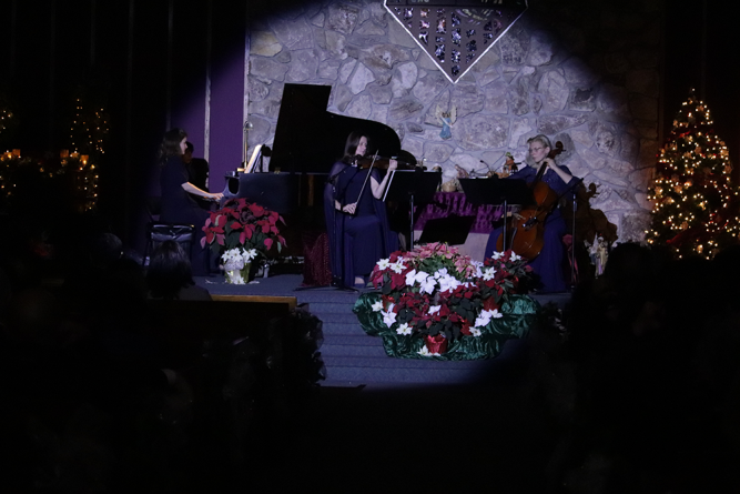 (From left to right) Hannah, piano; Lena, violin; and Olga, cello perform a variety of Christmas songs at the December concert.