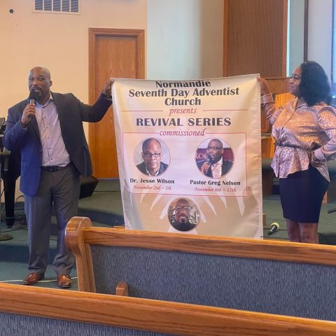 Chatman (left) presents to the congregation the revival series at Normandie Avenue church.