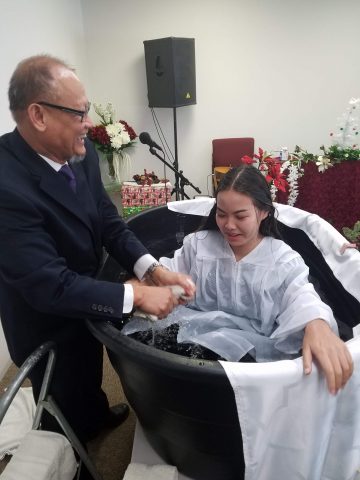 Angelina is all smiles after being baptized in the unconventional baptistery. Photos provided by James Dok