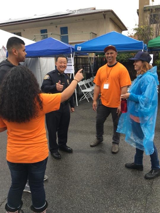 Gardena Police Chief Tom Kang shares his support during a photo op as he meets with volunteers. Photo provided by Iki Taimi.