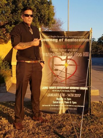 Hill is pictured with a banner for his “Journey of Restoration” evangelistic series in 2017. Photos provided by Holly Anderson.