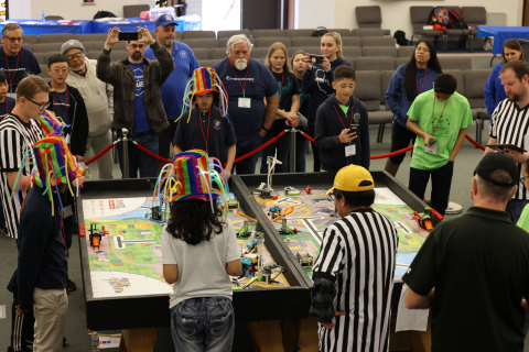 Each team competes in three rounds to determine their high score. Team Antelope Valley Atoms from Antelope Valley Adventist School (left) are at the table with Team BumperBots (right) from Loma Linda Academy.