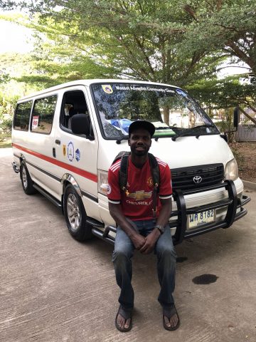 Bonneau is pictured with the van used to transport Burmese migrants to medical care. Photos provided by Fedly Bonneau.