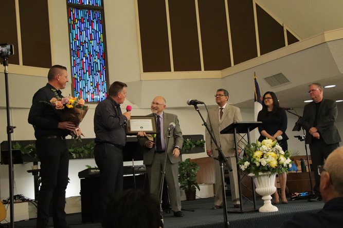 From left to right: Ed Sammons, pastor; Keith Harrison, head elder; John H. Cress, SCC executive secretary; Velino
A. Salazar, SCC president; Kathleen V. Diaz, SCC treasurer/CFO; and Greg Hoenes, SCC West Region director. Cress presents Harrison with a plaque commemorating Lancaster church’s 100th anniversary.