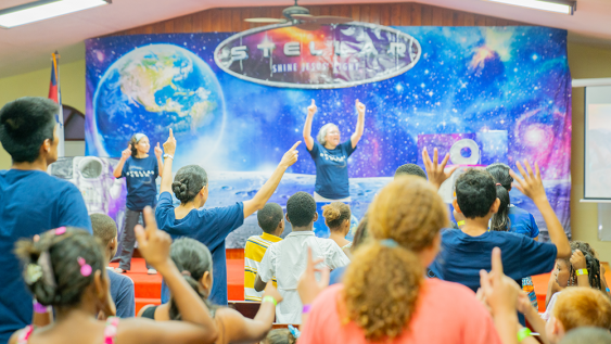 Kids sing along to music at Stellar VBS