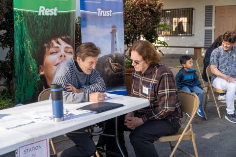 Diehl conducts a one-on-one health evaluation with a participant during the 2023 health risk assessment.