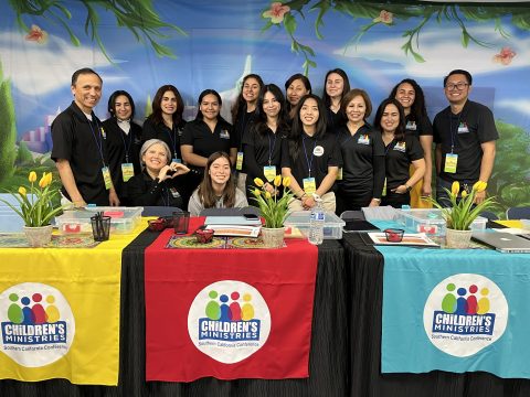 Jaime (far left) and Jenny (bottom row, left) pose for a picture with SCC children's ministries leaders and volunteers during a training event in April 2023.